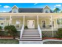 Inviting front porch with white railings and stairs leading to the entrance at 3133 Callie Still Rd, Lawrenceville, GA 30045