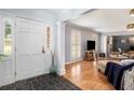 Bright entryway with tile flooring, leading to living room at 5513 N Peachtree Rd, Dunwoody, GA 30338
