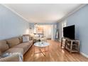 Living room with hardwood floors, large TV, and comfy seating at 5513 N Peachtree Rd, Dunwoody, GA 30338