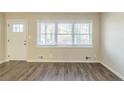 Living room with wood-look floors and neutral walls at 3701 Glen Mora Dr, Decatur, GA 30032
