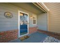 Townhome entrance with blue door and brick accents at 3284 Long Iron Pl, Lawrenceville, GA 30044