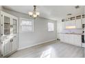 Eat-in kitchen with white cabinets and vinyl flooring at 24 Echo Ridge Dr, Powder Springs, GA 30127