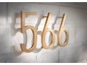 Modern gold house numbers on a white brick wall at 566 Church Ne St, Marietta, GA 30060