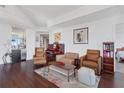 Spacious living room featuring hardwood floors, comfortable seating, and access to kitchen, bedroom and balcony at 3325 Piedmont Ne Rd # 2702, Atlanta, GA 30305