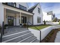 Elegant front entry with stone steps and a welcoming porch at 122 Owens Mill Pl, Canton, GA 30115