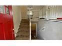 View of the staircase leading to the upper level, red front door visible at 1272 Marlwood Ct, Stone Mountain, GA 30083