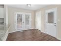 Dining area with wood-look floors and access to a deck at 1884 Martin Sw Rd, Marietta, GA 30008