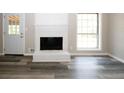 Living room with fireplace and wood-look floors at 3130 Mars Hill Rd, Acworth, GA 30101