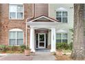A welcoming entrance with white columns and beautiful plants enhances curb appeal at 1965 Nocturne Dr # 1209, Alpharetta, GA 30009