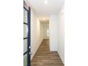 Bright hallway with wood-look floors leading to the main living area at 1395 Ben Park Way, Grayson, GA 30017