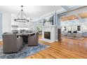 Open concept dining area with hardwood floors, fireplace, and kitchen view at 1658 E Clifton Ne Rd, Atlanta, GA 30307