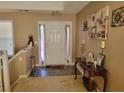 Bright entryway with tile flooring and decorative console table at 155 Vinnys Way, Covington, GA 30014