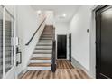 Interior entryway with stairs and hardwood floors at 1244 Oxley Nw Ln, Atlanta, GA 30307