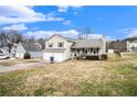 Two-story house with a spacious yard and a two-car garage at 1360 Paddocks Way, Powder Springs, GA 30127