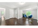 Bright dining area with glass table and blue chairs at 1507 Lively Ridge Ne Rd, Atlanta, GA 30329