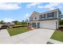 Charming two-story home with a two-car garage and well-maintained lawn situated in a residential area at 126 Cherry Glen Way, Euharlee, GA 30145