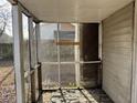 Interior view of the weathered screened porch at 3965 Pecan Rd, Loganville, GA 30052