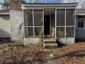 Small screened porch with stone steps at 3965 Pecan Rd, Loganville, GA 30052