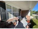 Relaxing front porch with wicker furniture and potted plants at 2280 Hickory Station Cir, Snellville, GA 30078
