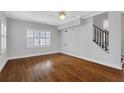 Bright living room with hardwood floors, plantation shutters, and a ceiling fan at 285 Oxford Ne Pl # 4, Atlanta, GA 30307