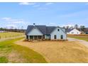 New construction farmhouse situated on a spacious lot with a long driveway at 628 Ridge Rd, Dallas, GA 30157
