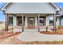 Covered front porch features wooden posts and a charming wood door at 628 Ridge Rd, Dallas, GA 30157