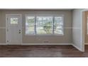 Living room entryway with hardwood floors and neutral walls at 2599 Browns Mill Se Rd, Atlanta, GA 30354