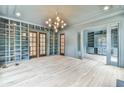 Spacious library with built-in bookshelves, hardwood floors, and French doors at 590 Clubwood Ct, Marietta, GA 30068