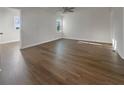 A spacious, light-filled bedroom boasts modern flooring and ample natural light from a window, creating a serene space at 555 Bridge Ave, Forest Park, GA 30297