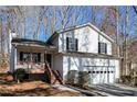 Front view of a two-story house with a deck at 850 Oxford Hall Dr, Lawrenceville, GA 30044