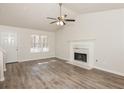 Spacious living room with fireplace and hardwood floors at 850 Oxford Hall Dr, Lawrenceville, GA 30044