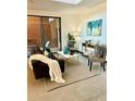 Bright living room with comfortable seating, stylish decor, and sliding glass doors to outdoor patio at 972 Dekalb Ne Ave # 203, Atlanta, GA 30307