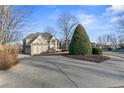 Spacious driveway leading to a stunning brick home with mature trees at 3352 Forest Vista Dr, Dacula, GA 30019
