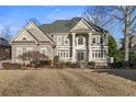 Impressive brick home with classic columns and a meticulously maintained lawn at 3352 Forest Vista Dr, Dacula, GA 30019