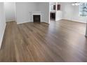 Hardwood floors in open concept living room with fireplace at 5165 Hanover St, Atlanta, GA 30349
