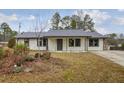 Newly renovated Ranch home with gray roof and well-maintained yard at 3590 Ashley Woods Dr, Powder Springs, GA 30127
