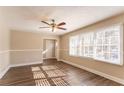 Spacious living room with hardwood floors and large windows at 2668 Woodfen Dr, Ellenwood, GA 30294