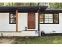 House exterior featuring a white brick facade and wood accents at 1847 Elmwood Dr, Austell, GA 30106