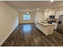 Open concept kitchen with granite island and stainless steel appliances at 449 Broder Farms Dr, Stockbridge, GA 30281