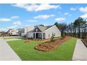 Charming single-story home with a well-manicured lawn and side-walk at 1002 Rainier Dr, Euharlee, GA 30145