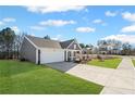 Charming single-story home with a well-manicured lawn and a long driveway at 1002 Rainier Dr, Euharlee, GA 30145