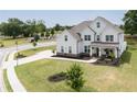 Two-story white farmhouse with gray roof and landscaping at 301 Rexmere Rd, Mcdonough, GA 30252