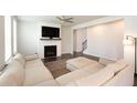 Living room featuring a sectional sofa and a gas fireplace at 301 Rexmere Rd, Mcdonough, GA 30252