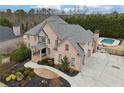Impressive two-story home with pool and lush landscaping at 206 Woodridge Pkwy, Canton, GA 30115