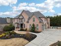 Brick house with 3 car garage, pool, and manicured landscaping at 206 Woodridge Pkwy, Canton, GA 30115
