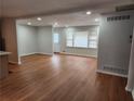 Spacious living room featuring hardwood floors and lots of natural light at 2614 Lilac Dr, Morrow, GA 30260