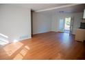 Bright living room with hardwood floors and access to a deck at 2614 Lilac Dr, Morrow, GA 30260