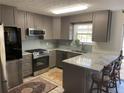 Modern kitchen with granite countertops and stainless steel appliances at 517 Carrington Ct, Canton, GA 30115