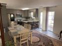 Eat-in kitchen with granite countertops and island at 517 Carrington Ct, Canton, GA 30115