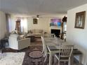 Spacious living room with dining area and fireplace at 517 Carrington Ct, Canton, GA 30115